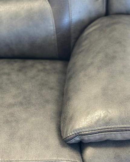 Close-up of the plush armrest and seating area of the Hannan 2 Seater Electric Recliner Sofa in grey micro fabric.