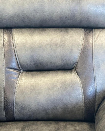 Close-up of the plush grey micro fabric upholstery of a Hannan 2 Seater Electric Recliner Sofa.