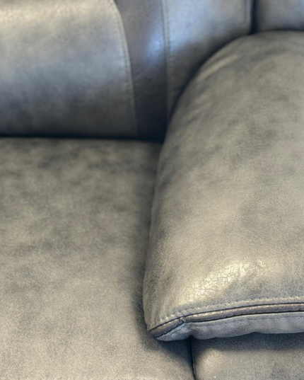Close-up of the Nova 3 Seater Electric Recliner Sofa in Grey Aire Leather, showcasing plush armrest and luxurious texture.