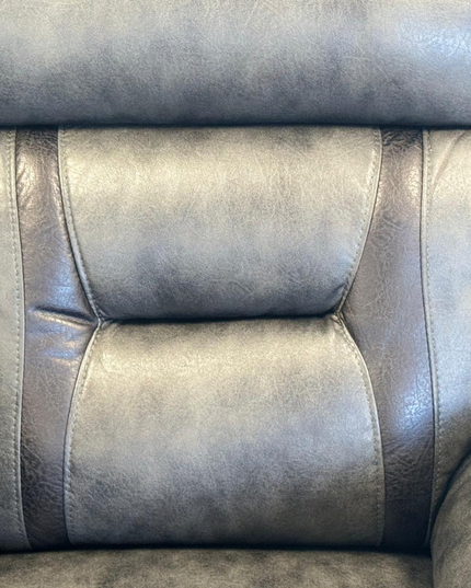 Close-up of the Nova 3 Seater Electric Recliner Sofa in Grey Aire Leather showcasing detailed stitching and plush upholstery.