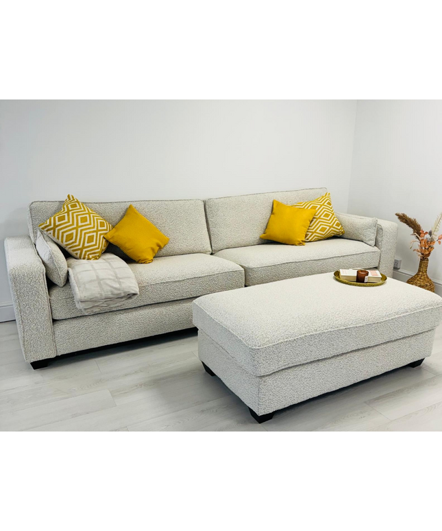 Bloomsbury luxury cream sofa with yellow cushions and matching footstool in modern living room.
