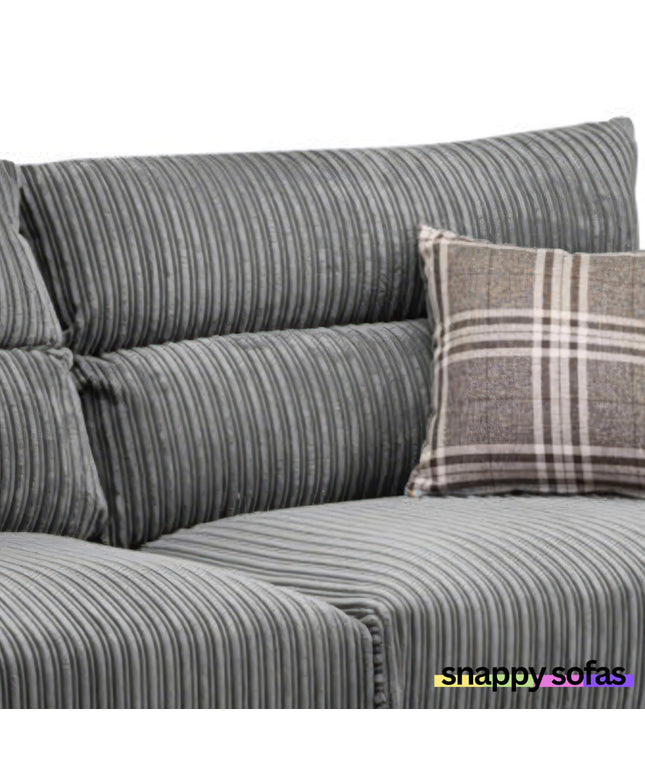 Close-up of Harley 3+2 Fabric Sofa in plush grey jumbo cord with checkered cushion, showcasing comfort and style.