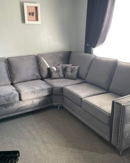 Alaska Double Corner Sofa in plush velvet, showcasing modern design with square arms and diamond button detailing.