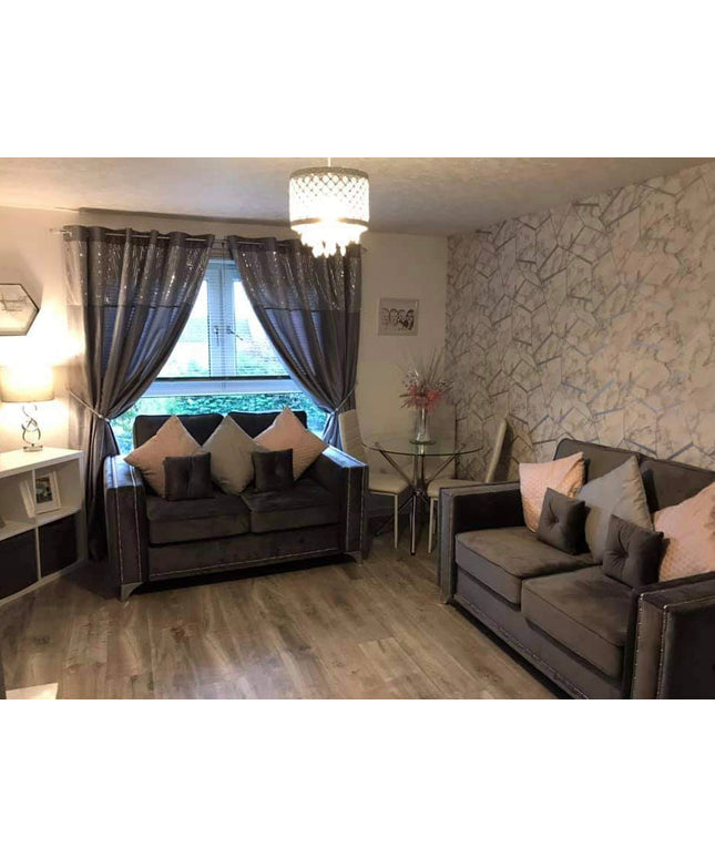 Cozy living room featuring Alaska 2 seater sofa with diamond tufting and elegant decor accents.