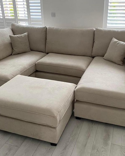 Carnaby Small U Shape Sofa with Footstool in neutral fabric, perfect for stylish and functional living spaces.