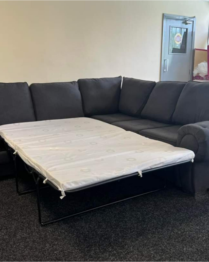 Chicago corner sofa bed in black and grey, showcasing sleek design and practical sleeper functionality.