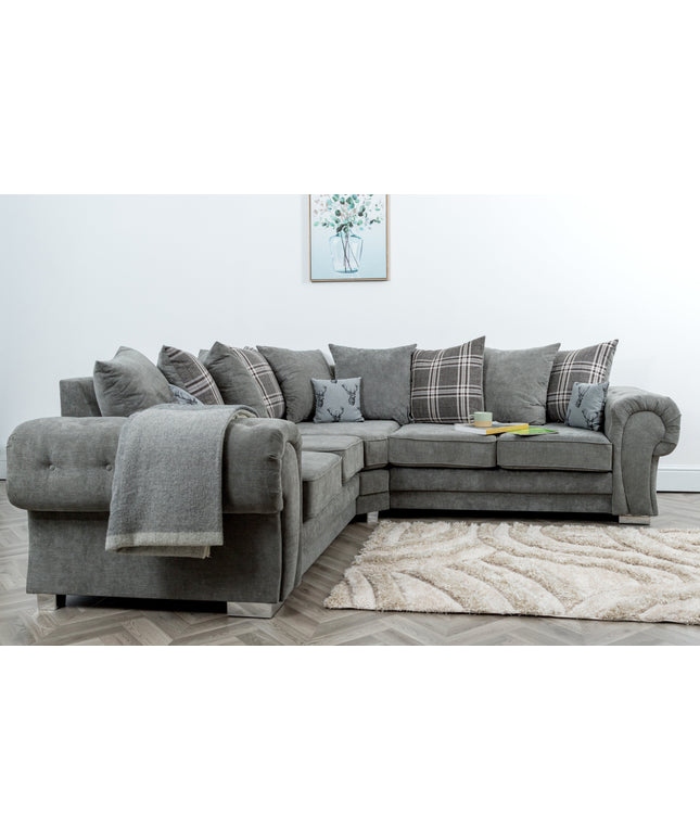 Verona modular corner sofa in grey with scatter-back cushions and stylish accessories on a cozy rug.