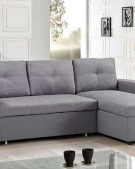Veronica pull-out sofa bed in grey linen fabric with storage and reversible chaise lounge.