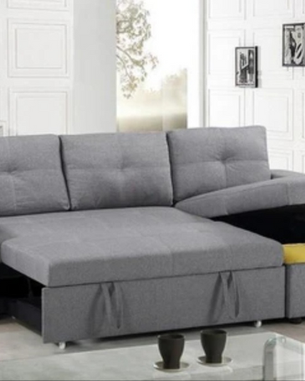 Veronica pull-out sofa bed in grey linen fabric with concealed storage and reversible chaise.