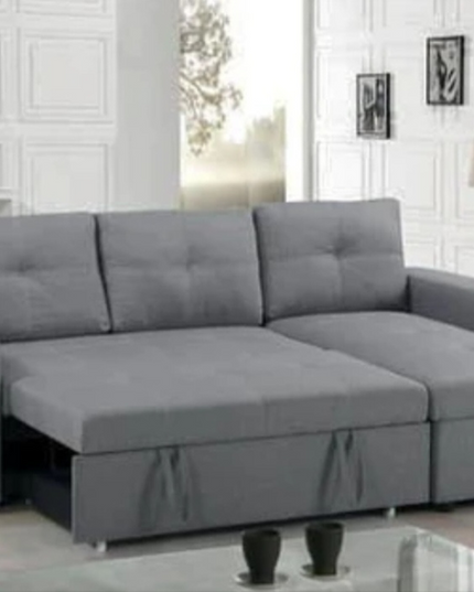 Veronica pull-out sofa bed in grey linen fabric with storage and reversible chaise for versatile living room setup.