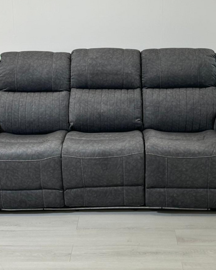 Hannan 3-seater electric recliner sofa in soft grey micro fabric with contrasting white piping.