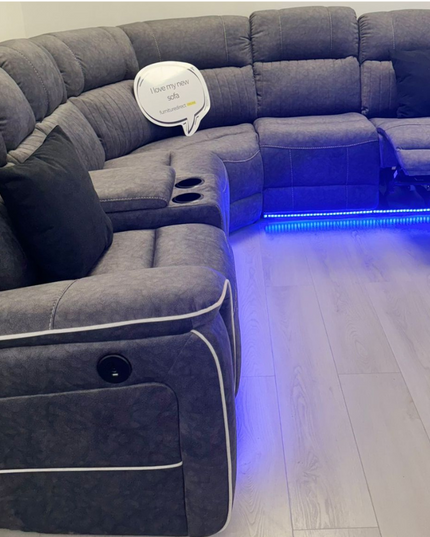 Hannan electric recliner corner sofa in grey micro fabric with LED lighting and reclining section.