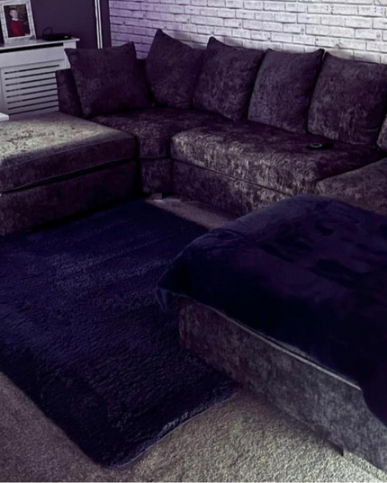 Modern London U Shape sofa in soft chenille with cushioned seats and cozy footstools.