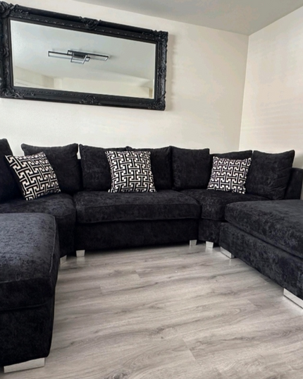 Modern U Shape sofa in luxurious black chenille with stylish scatter cushions and removable footstools.