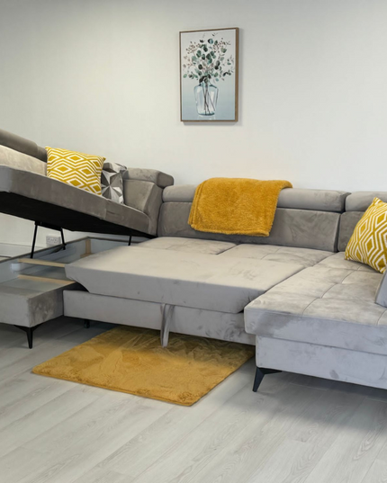 Sovereign U Shape pull-out sleeper sofa in plush velvet with storage, featuring yellow decorative pillows.