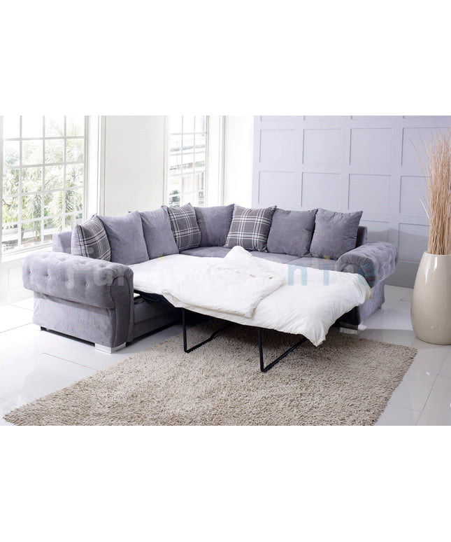 Verona Fernando grey corner sofa bed with scatter back cushions, extended for a cozy sleeper option.